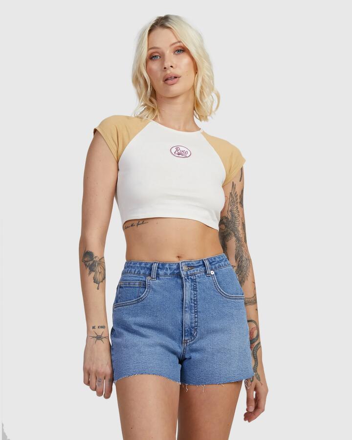 Image of a model wearing Shorts. Product name - RVCA Womens Pacific Denim Shorts Washed Blue in Washed Blue colour by brand - RVCA