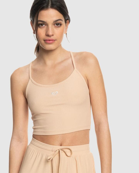 Image of a model wearing Tops. Productname: Roxy - Womens Rise & Vibe Sports Tank Top - Toasted Almond - in Toasted Almond colour by brand - Roxy