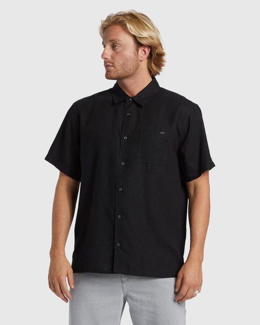 Image of a model wearing Tops. Productname: Billabong - Mens Ricardo Short Sleeve Shirt - Black - in Black colour by brand - Billabong