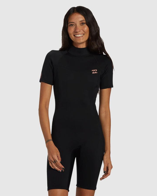 Image of a model wearing Tops. Product name - Billabong Womens 2/2Mm Foil Springsuit Black in Black colour by brand - Billabong