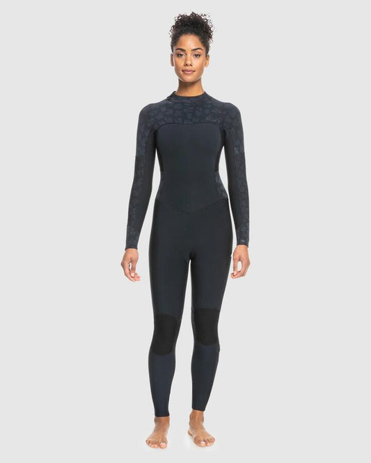 Image of a model wearing Tops. Productname: Roxy - Womens 3/2Mm Swell Series Gbs Back Zip Wetsuit - Black - in Black colour by brand - Roxy