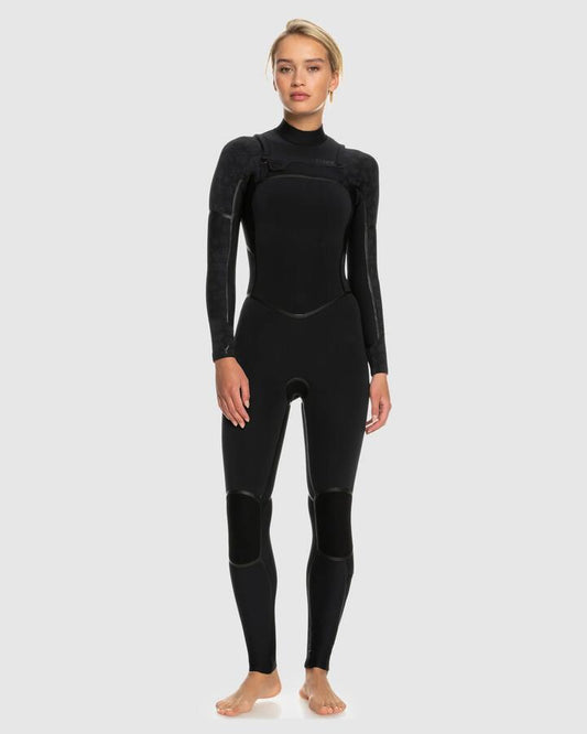 Image of a model wearing Tops. Productname: Roxy - Womens 4/3Mm Swell Series Lfs Chest Zip Wetsuit - Black - in Black colour by brand - Roxy
