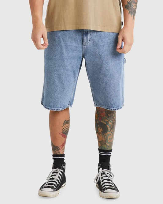 Image of a model wearing Shorts. Productname: RVCA - Mens Americana Denim Shorts - Broken Blue Wash - in Broken Blue Wash colour by brand - RVCA