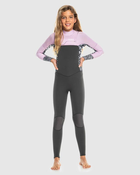 Image of a model wearing Tops. Productname: Roxy Girls 8-16 3/2Mm Swell Series Gbs Back Zip Wetsuit Jet/Orchid Bouquet - in Jet/Orchid Bouquet colour by brand - Roxy