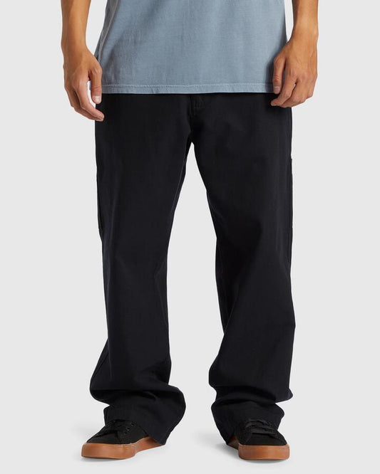 Image of a model wearing Pants. Productname: Quiksilver Mens Carpenter Canvas Cargo Pants Black - in Black colour by brand - Quiksilver