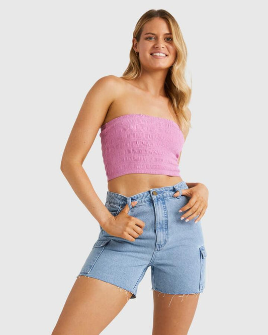 Image of a model wearing Tops. Productname: Billabong Womens Beach Babe Crop Top Berry Pink - in Berry Pink colour by brand - Billabong