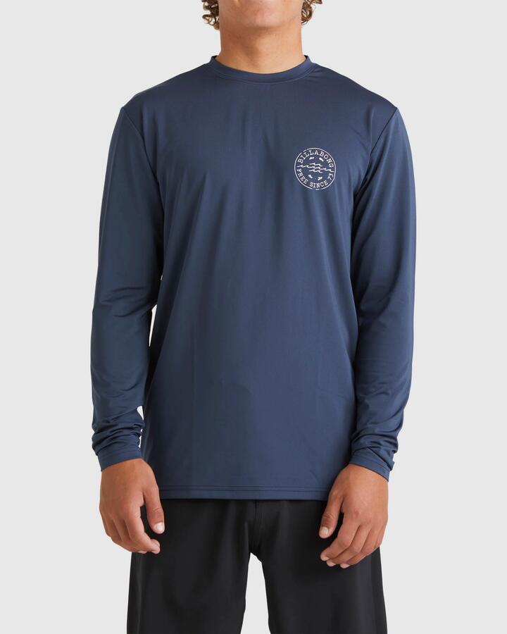 Image of a model wearing Tops. Productname: Billabong Mens Big Wave Daz Long Sleeve Rash Vest Dusty Navy - in Dusty Navy colour by brand - Billabong