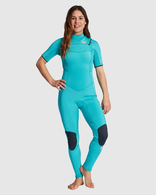 Image of a model wearing Tops. Productname: Billabong Womens 2/2Mm Synergy Chest Zip Short Sleeve Fullsuit Turq Nomad - in Turq Nomad colour by brand - Billabong
