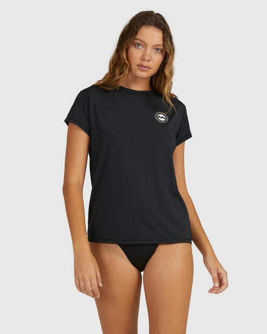 Image of a model wearing Tops. Product name - Billabong Womens Sundays Short Sleeve Rash Vest Black in Black colour by brand - Billabong