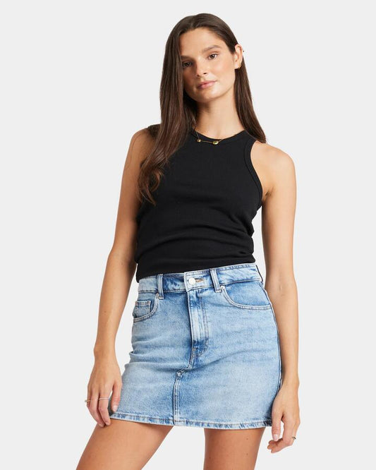 Image of a model wearing Skirts. Productname: Roxy - Womens Rain Beau Blue Denim Mini Skirt - Beau Blue - in Beau Blue colour by brand - Roxy