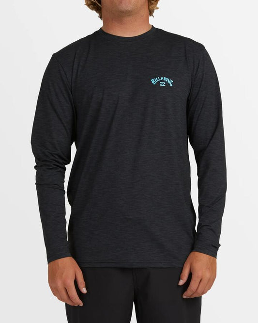 Image of a model wearing Tops. Product name - Billabong Mens Shoreline Loose Fit Long Sleeve Rash Vest Black Heather in Black Heather colour by brand - Billabong