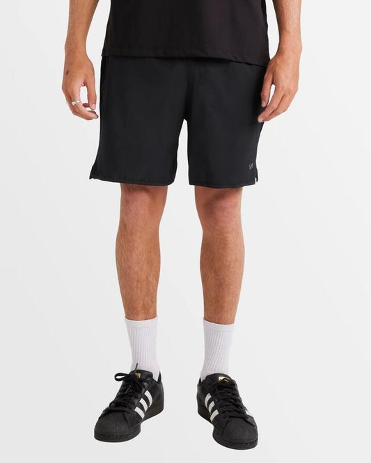 Image of a model wearing Shorts. Productname: RVCA - Mens Yogger Iv Short 17" Walkshorts - Black - in Black colour by brand - RVCA
