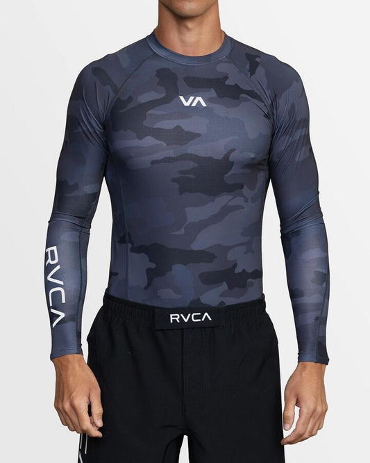 Image of a model wearing Tops. Productname: RVCA - Mens Sport Long Sleeve Rash Vest - Black Camo - in Black Camo colour by brand - RVCA