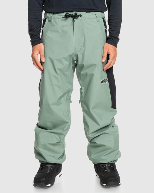 Image of a model wearing Pants. Productname: Quiksilver Mens High Altitude Gore-Tex Snow Pants Sea Spray - in Sea Spray colour by brand - Quiksilver