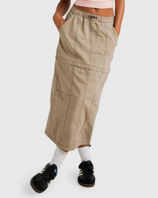 Image of a model wearing Skirts. Productname: RVCA Womens Stowaway Zip Off Midi Skirt Dark Khaki - in Dark Khaki colour by brand - RVCA