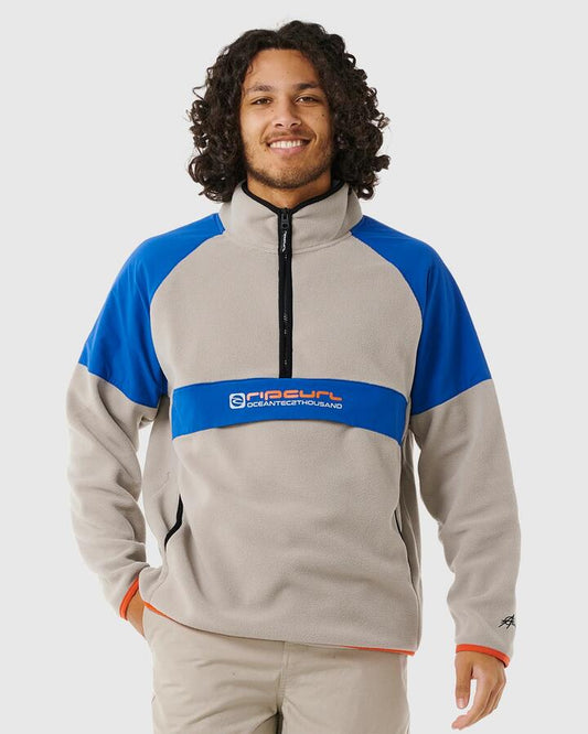 Image of a model wearing Outerwear. Productname: Rip Curl - Mens Anti Series Archive Zip Fleece Jumper - Stone - in Stone colour by brand - Rip Curl