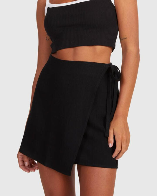 Image of a model wearing Skirts. Productname: Nunui Womens Tied Up Mini Skirt Black - in Black colour by brand - Nunui