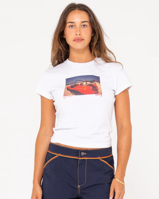 Image of a model wearing Tops. Productname: Rusty Womens Road Trip Short Sleeve Skimmer T-Shirt White - in White colour by brand - Rusty