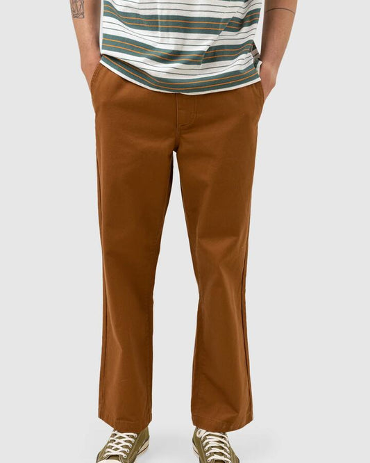 Image of a model wearing Pants. Productname: Rhythm Mens Worn Path Pants Brown - in Brown colour by brand - Rhythm