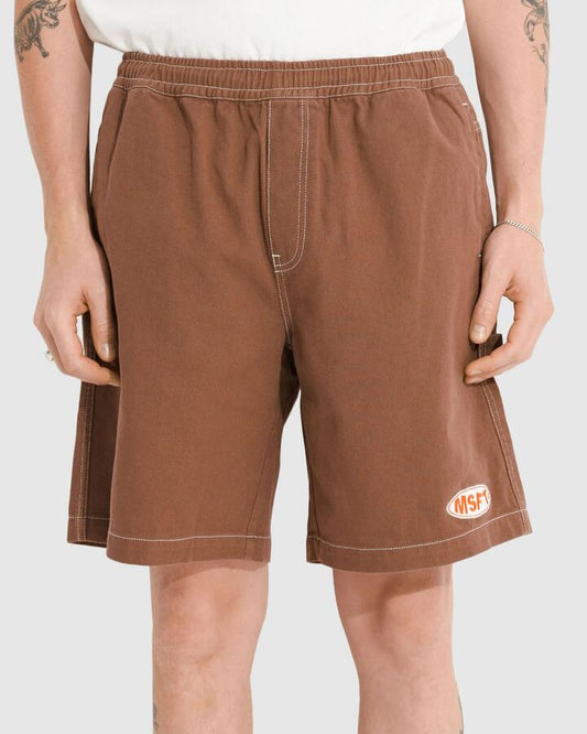 Image of a model wearing Shorts. Productname: Misfit - Mens Edge Of Care 20'' Walk Shorts - Faded Brown - in Faded Brown colour by brand - Misfit