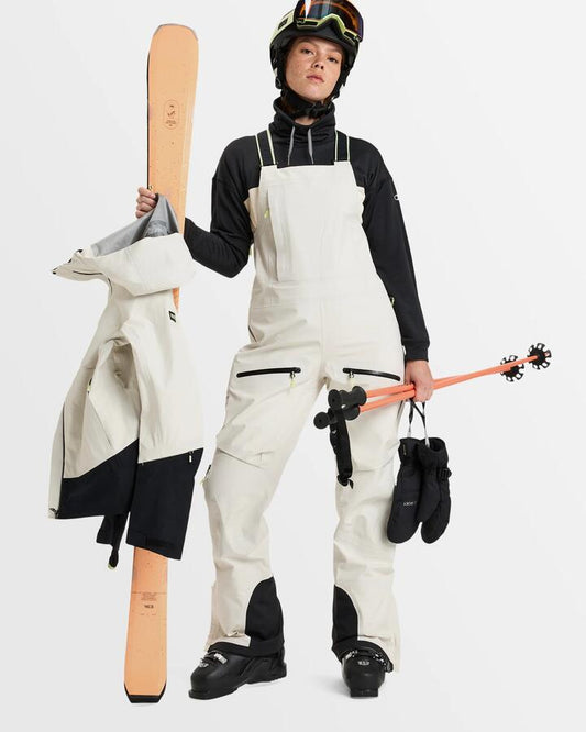 Image of a model wearing Pants. Productname: Roxy Womens Gore-Tex Lunalite 3L Bib Snow Pants Buttercream - in Buttercream colour by brand - Roxy