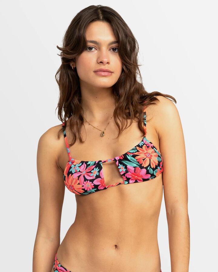 Image of a model wearing Tops. Product name - Roxy Womens Printed Beach Classics Bralette Bikini Top Anthracite Floral Fiesta Big in Anthracite Floral Fiesta Big colour by brand - Roxy