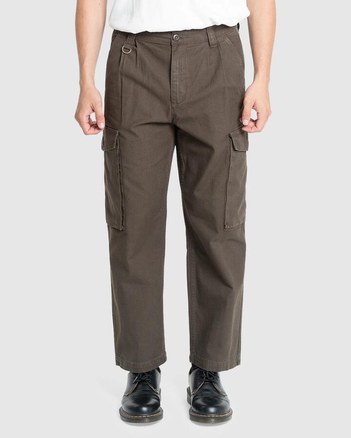 Image of a model wearing Pants. Product name - Thrills Mens Issued Big Slacker Cargo Pants Canteen in Canteen colour by brand - Thrills