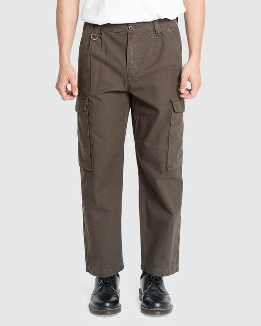 Image of a model wearing Pants. Product name - Thrills Mens Issued Big Slacker Cargo Pants Canteen in Canteen colour by brand - Thrills