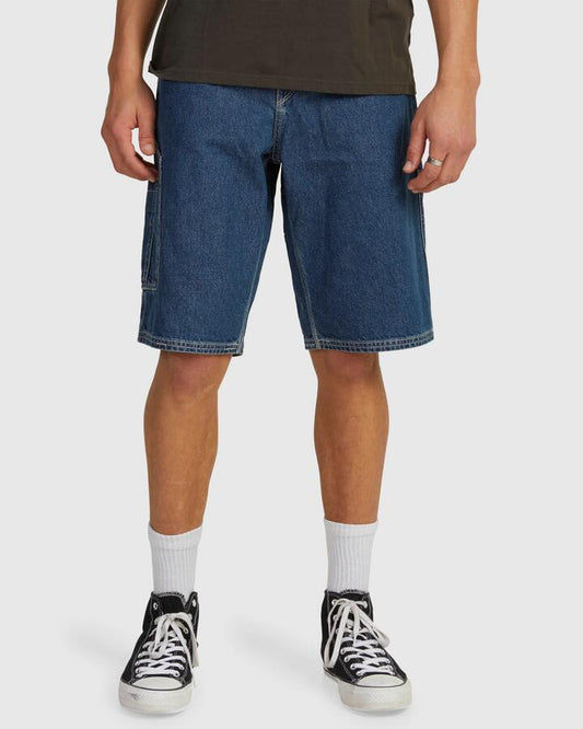 Image of a model wearing Shorts. Productname: Volcom Mens Labored Denim Utility Denim Short Indigo Ridge Wash - in Indigo Ridge Wash colour by brand - Volcom