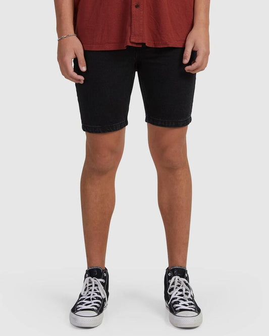 Image of a model wearing Shorts. Productname: Thrills - Mens Chopped Hem Denim Shorts - Aged Black - in Aged Black colour by brand - Thrills