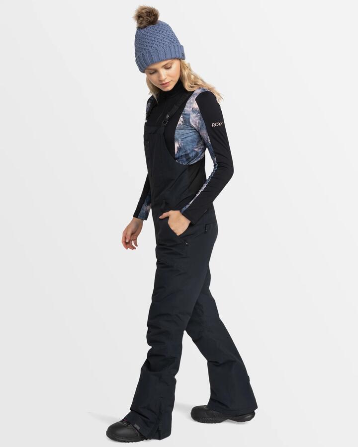 Image of a model wearing Pants. Product name - Roxy Womens Rideout Bib Snow Pants True Black in True Black colour by brand - Roxy