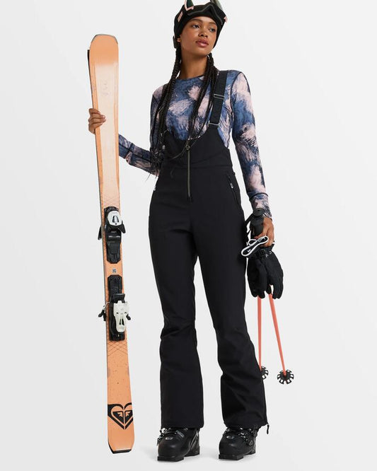 Image of a model wearing Pants. Productname: Roxy Womens Summit Bib Snow Pants True Black - in True Black colour by brand - Roxy