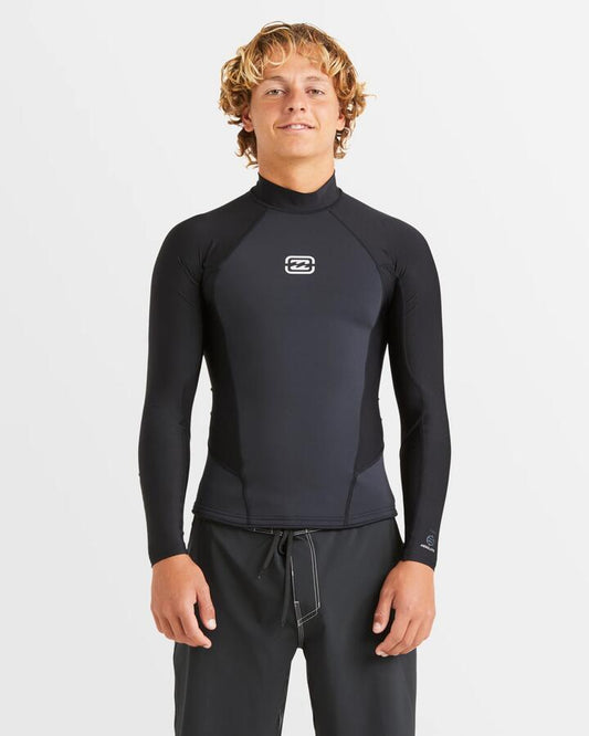 Image of a model wearing Tops. Productname: Billabong Mens 1Mm Absolute Poly Lite Long Sleeve Wetsuit Top Black - in Black colour by brand - Billabong