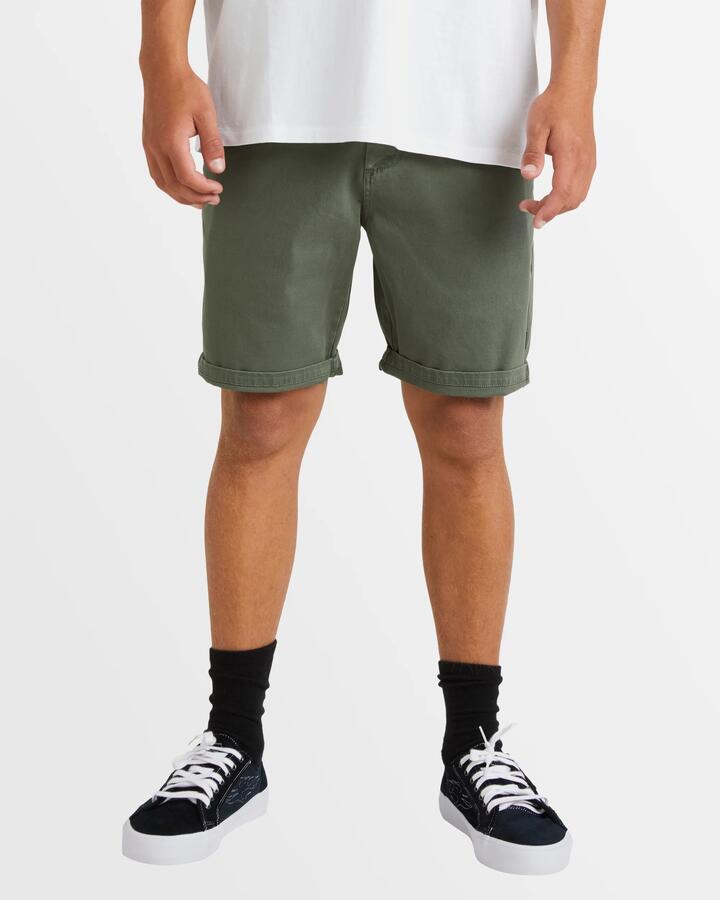 Image of a model wearing Shorts. Productname: Billabong - Mens Wave Wash Twill Chino Shorts - Fern - in Fern colour by brand - Billabong
