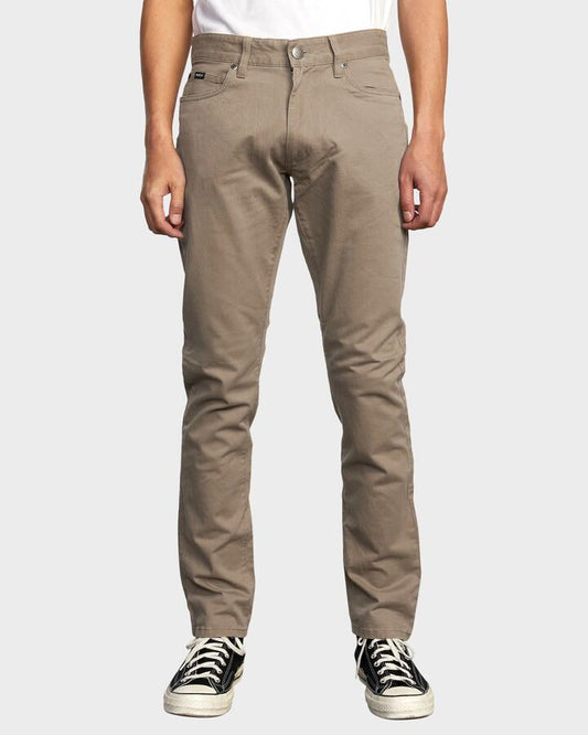 Image of a model wearing Pants. Product name - RVCA Mens Daggers Twill Pants Wood in Wood colour by brand - RVCA