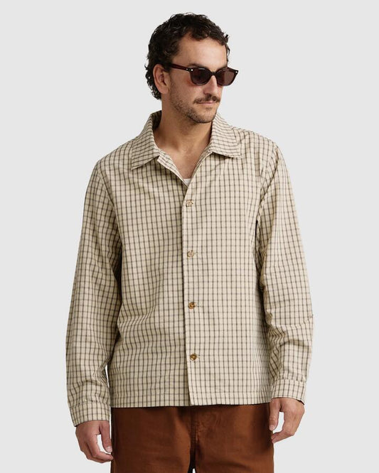 Image of a model wearing Tops. Productname: Rhythm - Mens Apres Check Long Sleeve Shirt - Sand - in Sand colour by brand - Rhythm