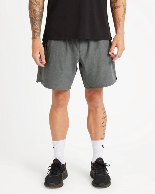 Image of a model wearing Shorts. Product name - RVCA Mens Yogger Stretch Walkshorts Charcoal Heather in Charcoal Heather colour by brand - RVCA