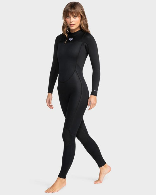 Image of a model wearing Tops. Productname: Roxy - Womens 3/2Mm Prologue Flatlock Back Zip Wetsuit - Black - in Black colour by brand - Roxy