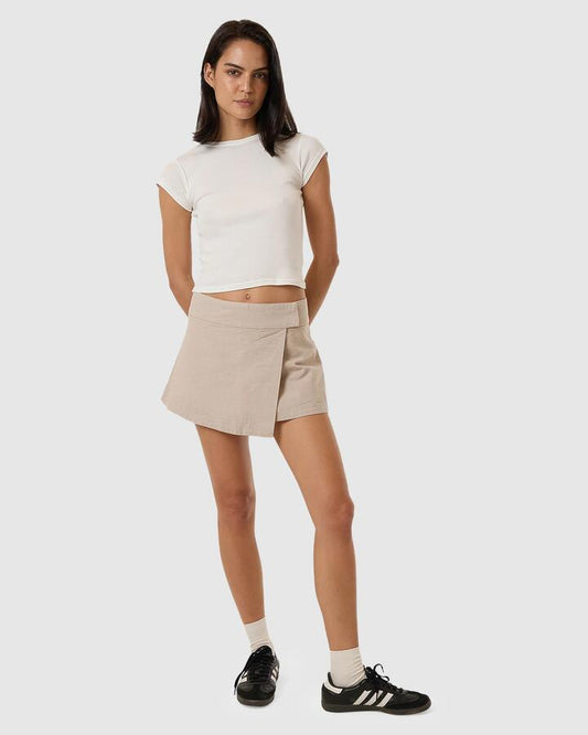 Image of a model wearing Skirts. Productname: Thrills - Womens Miramar Mini Wrap Skirt - Stone - in Stone colour by brand - Thrills