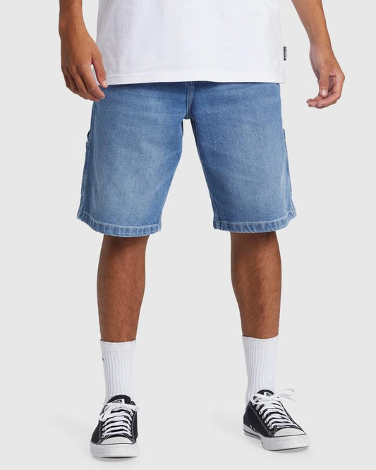 Image of a model wearing Shorts. Productname: Quiksilver - Mens Carpenter Denim Shorts - 2001 Stone Wash - in 2001 Stone Wash colour by brand - Quiksilver