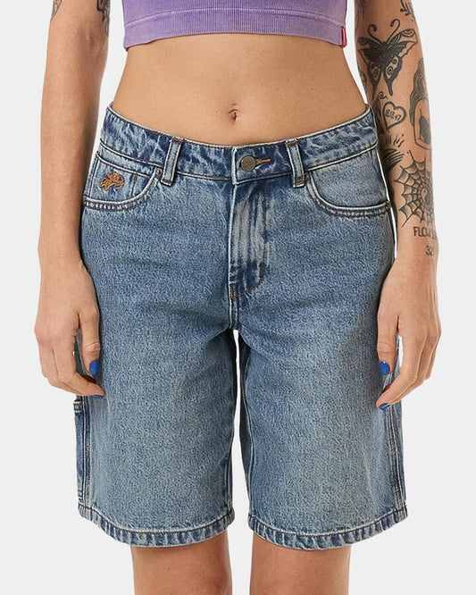 Image of a model wearing Shorts. Productname: Worship Womens Floater Carpenter Shorts Storm Blue - in Storm Blue colour by brand - Worship