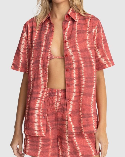 Image of a model wearing Tops. Productname: Rhythm - Womens Sahara Tie Dye Short Sleeve Shirt - Red - in Red colour by brand - Rhythm