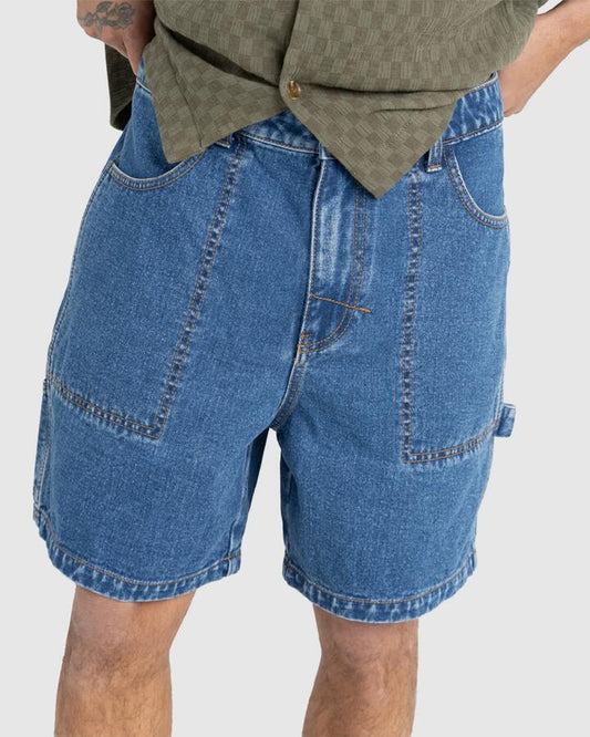 Image of a model wearing Shorts. Productname: Rhythm - Mens Slacker Denim Shorts - Indigo - in Indigo colour by brand - Rhythm