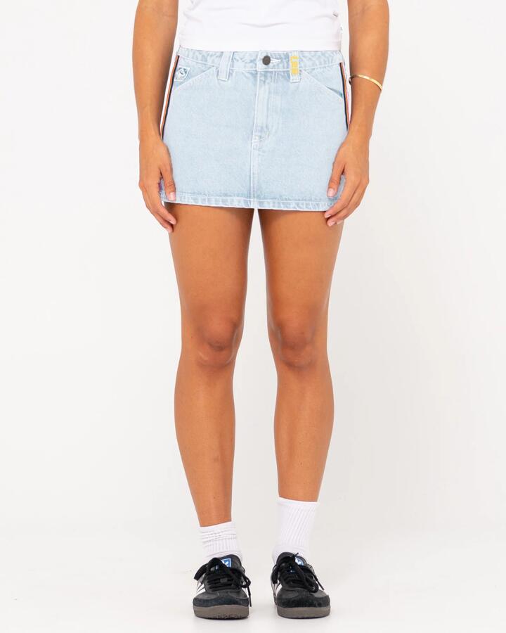 Image of a model wearing Skirts. Productname: Rusty - Womens Flip Mommy Low Rise Mini Denim Skirt - Sky Blue Heather/Red - in Sky Blue Heather/Red colour by brand - Rusty
