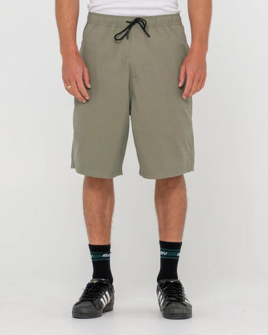 Image of a model wearing Shorts. Product name - Rusty Mens Wear Eva Elastic Shorts Savanna in Savanna colour by brand - Rusty