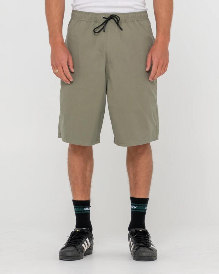 Image of a model wearing Shorts. Product name - Rusty Mens Wear Eva Elastic Shorts Savanna in Savanna colour by brand - Rusty