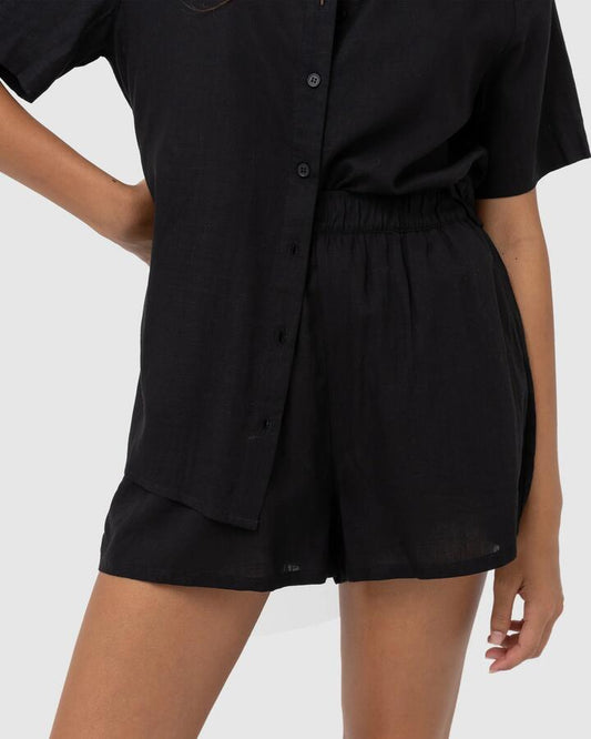 Image of a model wearing Shorts. Productname: Rhythm - Womens Classic Beach Shorts - Black - in Black colour by brand - Rhythm