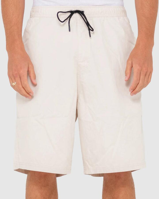 Image of a model wearing Shorts. Productname: Rusty - Mens Wear Eva Elastic Shorts - Oatmeal - in Oatmeal colour by brand - Rusty