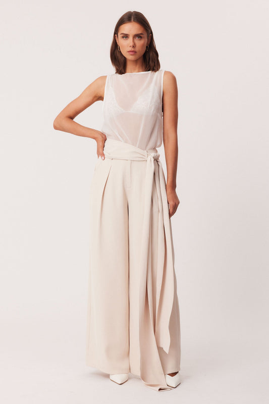 Image of a model wearing Pants. Productname: SNDYS REID PANTS in Stone colour by brand - SNDYS