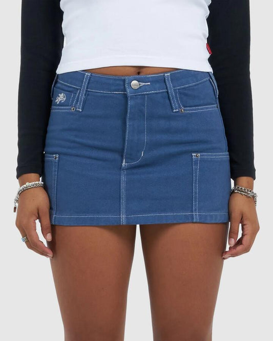 Image of a model wearing Skirts. Productname: Worship - Womens Patches Rivet Mini Skirt - Folkstone Overdye - in Folkstone Overdye colour by brand - Worship